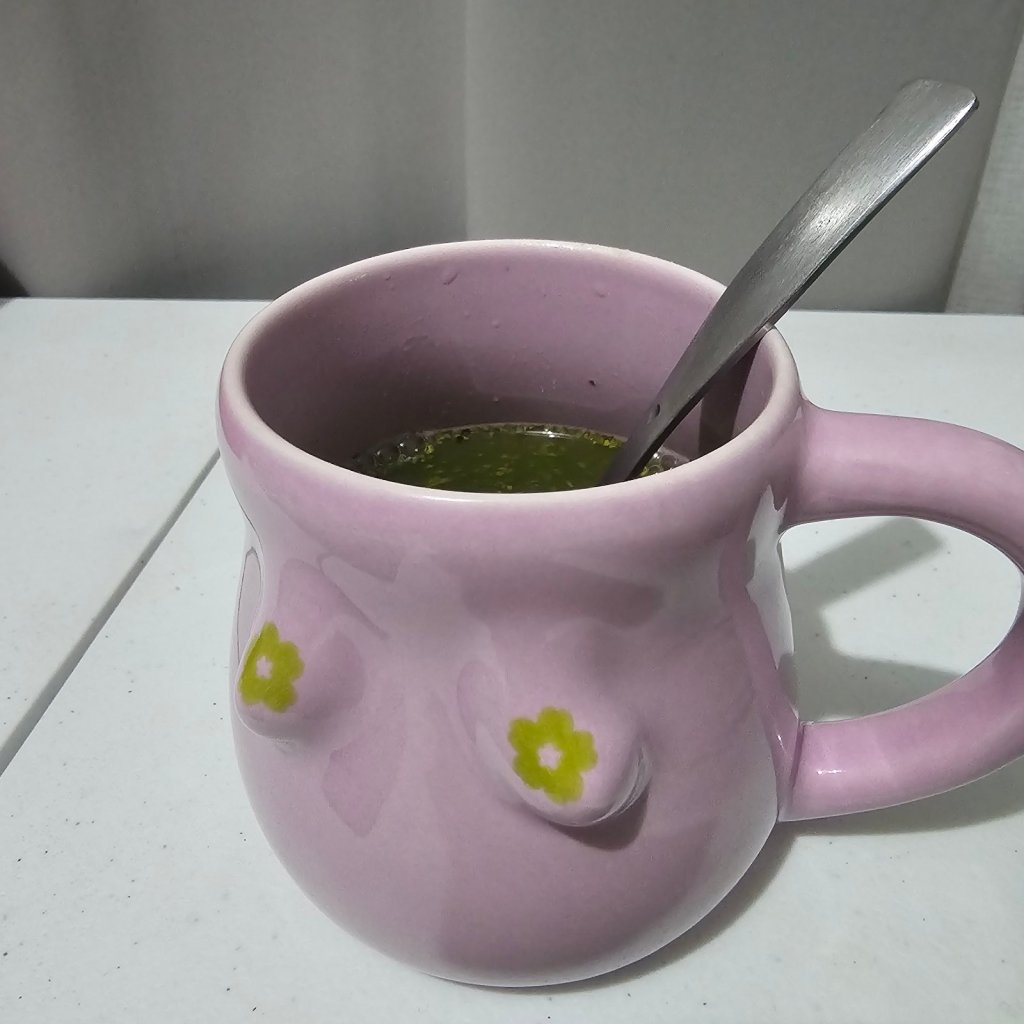 mug with cuddle and coo malunggay and acai berry juice